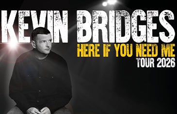 Kevin Bridges comedy tour promotional graphic featuring a black and white portrait of the comedian with spotlight lighting and bold distressed text reading ‘Here If You Need Me Tour 2026’. Kevin Bridges – 365 x 235 px