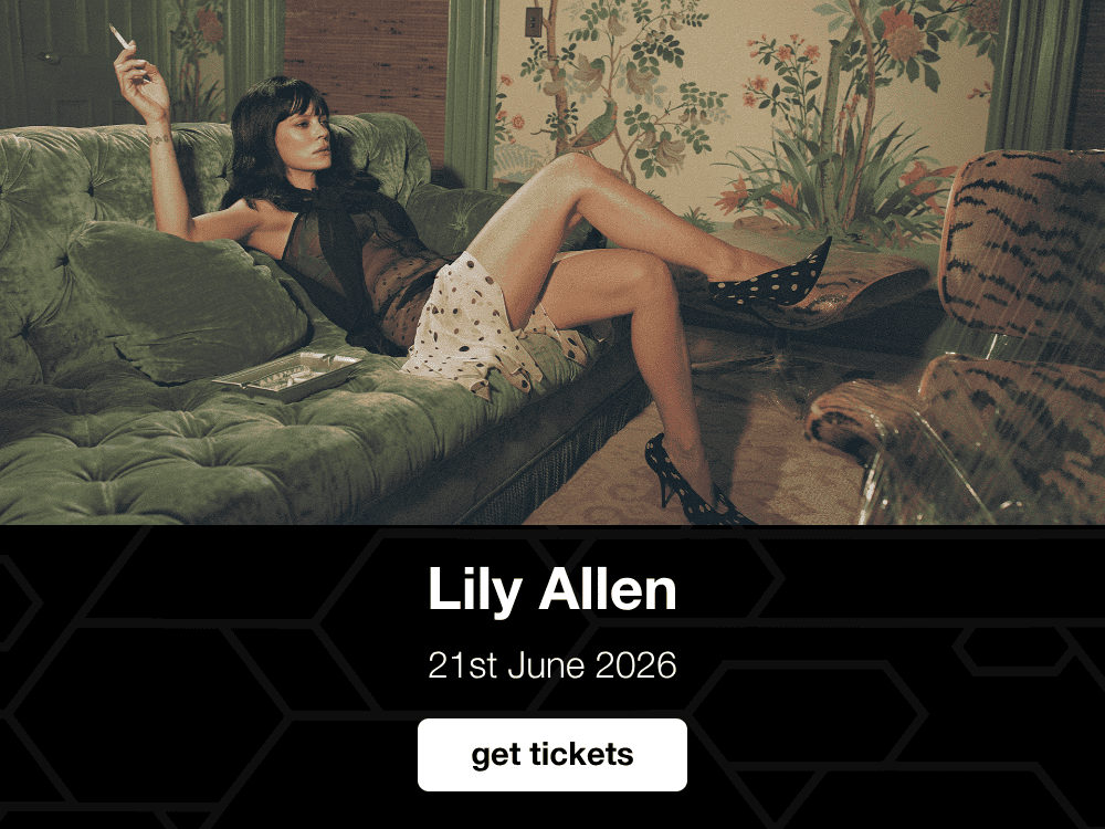 Lily Allen lounging on a green velvet sofa in a retro-styled room, holding a cigarette, with a concert announcement and ticket call-to-action below - 1000 × 750
